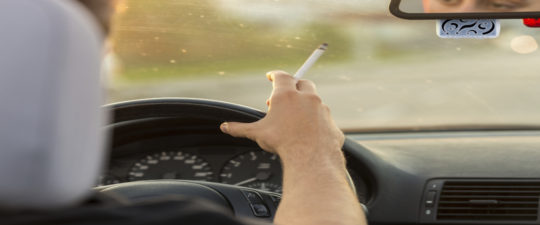 Man Smoking in car